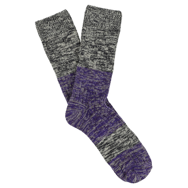 A pair of melange block socks in navy and purple colors, crafted from cotton blend yarns and made in Portugal