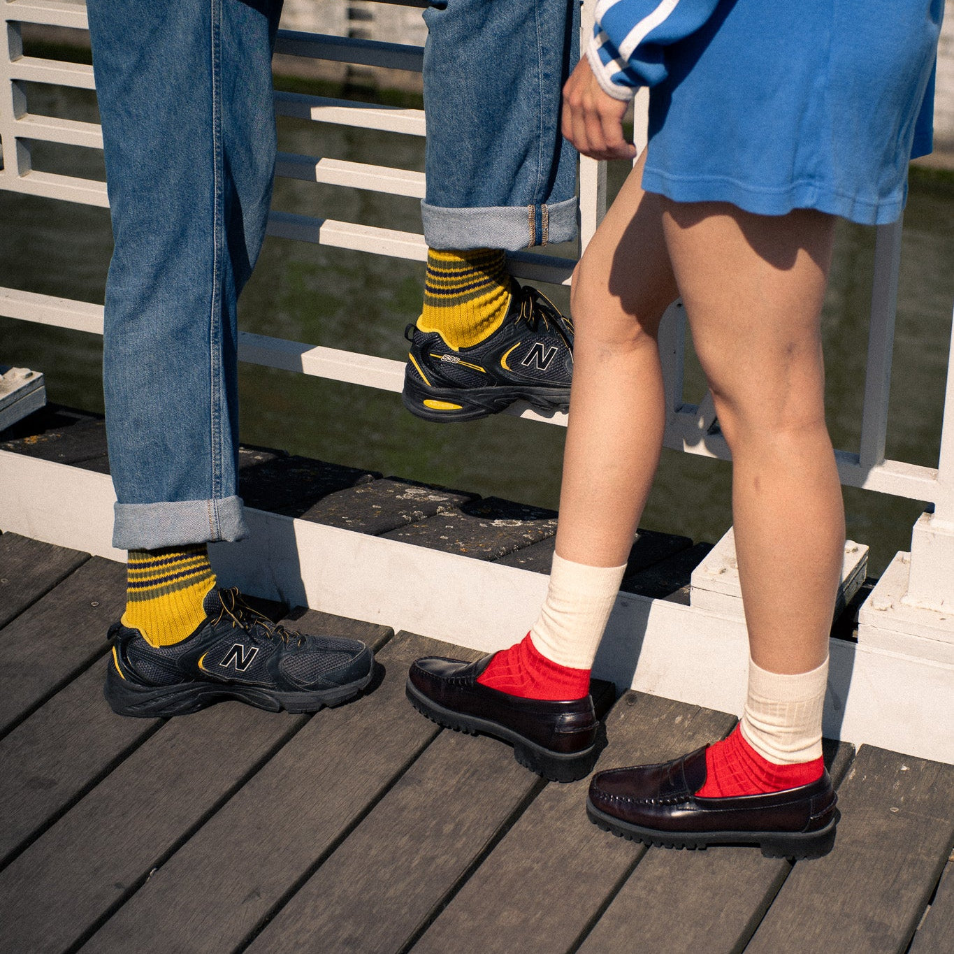 Escuyer Sock Subscription — two people wearing colourful Escuyer socks, handcrafted in Portugal