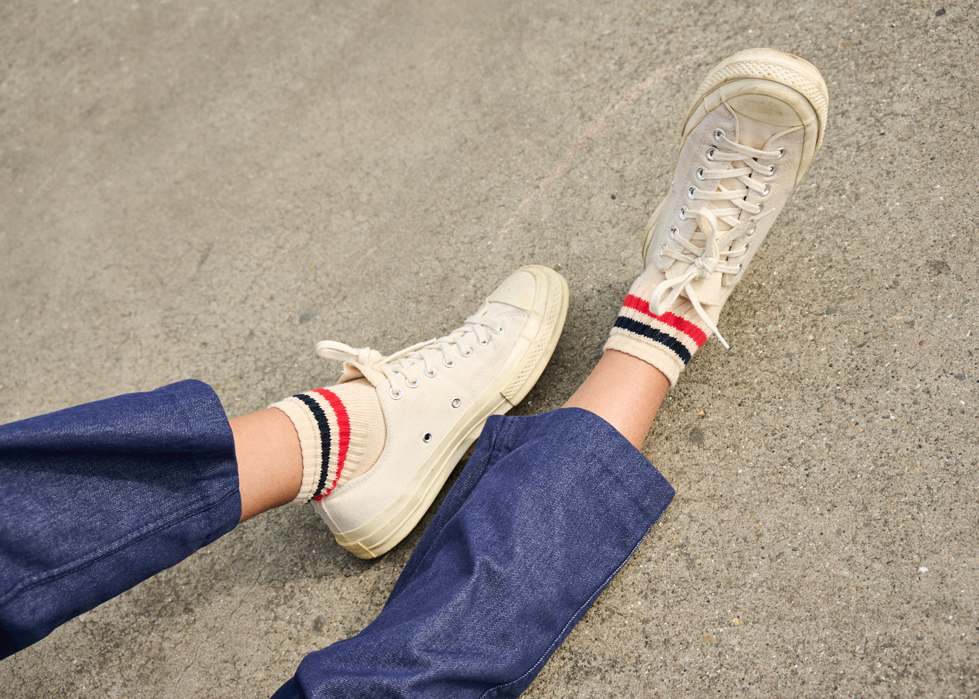 Ankle socks styled with denim overalls and canvas sneakers — summer 2026