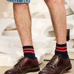 Man wearing Escuyer Men Striped Ankle Socks Blue / Orange with brown loafers — vintage athletic style