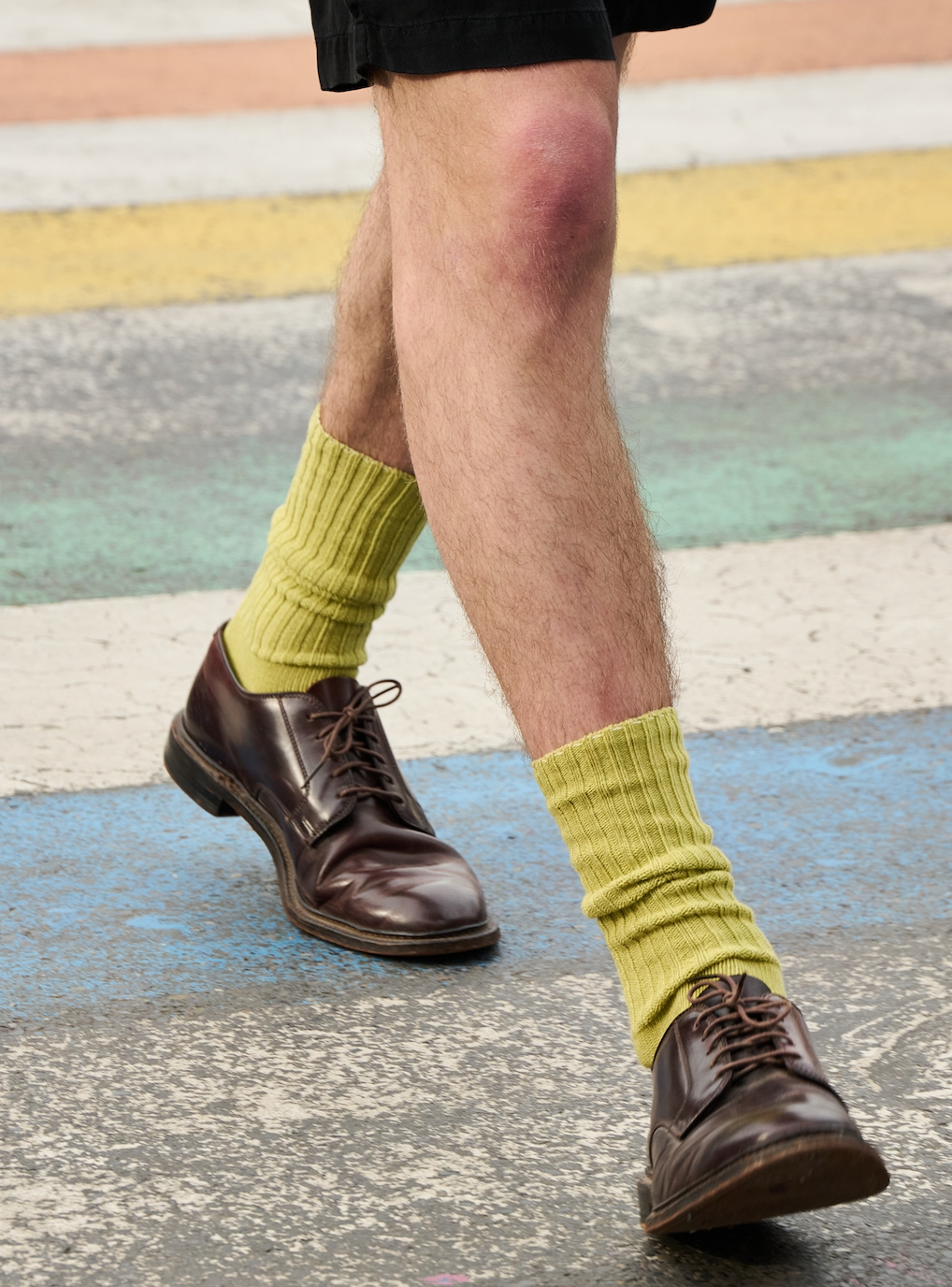 Man wearing green bandana ribbed crew socks by Escuyer, made in Portugal