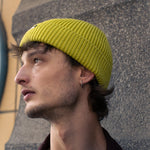 Person wearing an Escuyer ribbed merino wool beanie