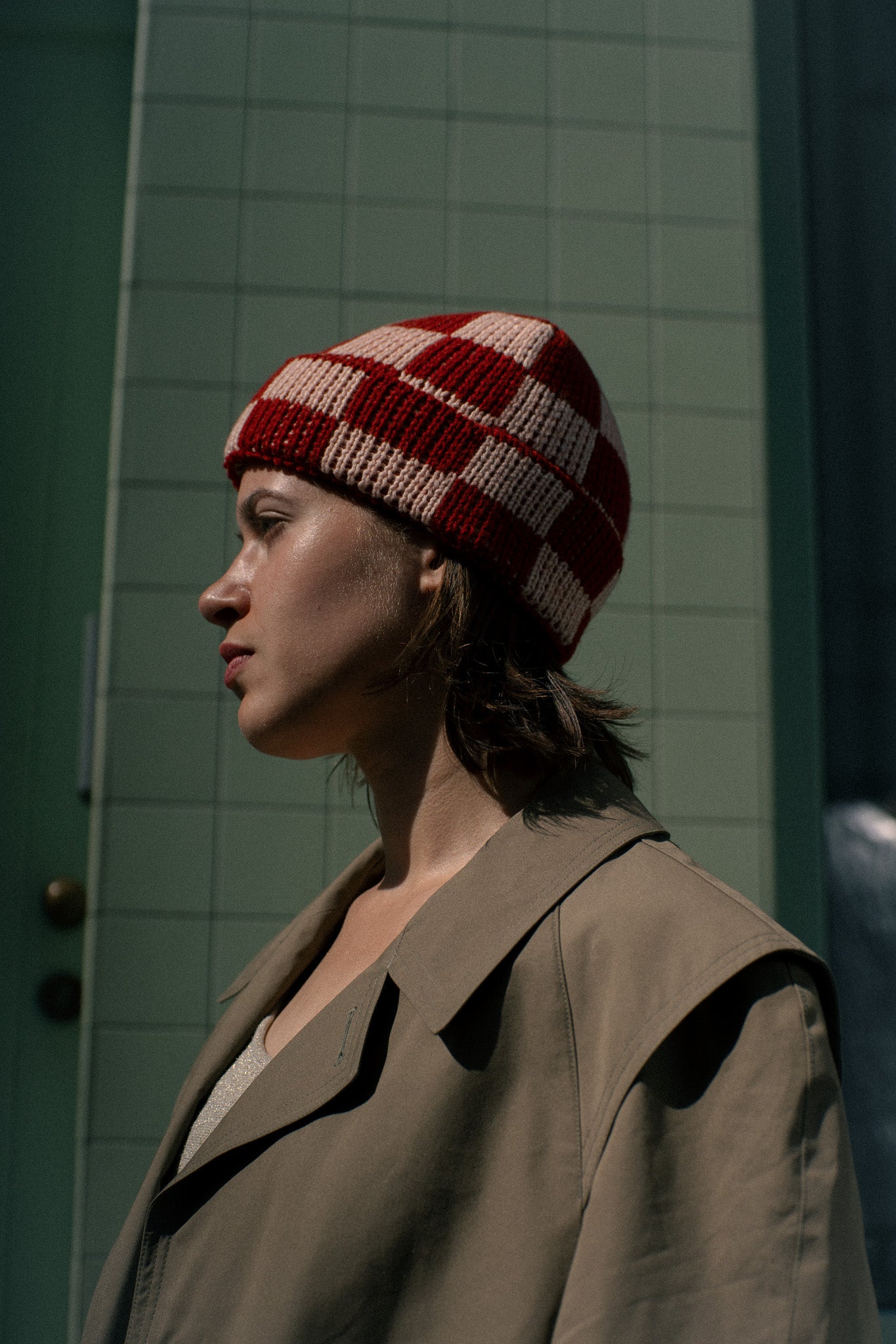 Checkered merino wool beanie shown on a plain background