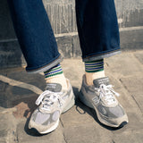 Escuyer Women's striped socks worn with New Balance sneakers — 5 Stripes collection, made in Portugal