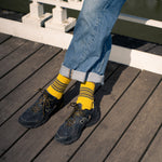 Escuyer Men's striped socks worn with New Balance sneakers — vintage athletics-inspired, hand-linked toe, made in Portugal