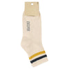 Beige sock with yellow and blue striped cuff on a white background