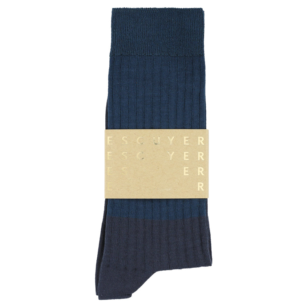 Navy blue sock with a beige label on a white background