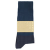 Navy blue sock with a beige label on a white background