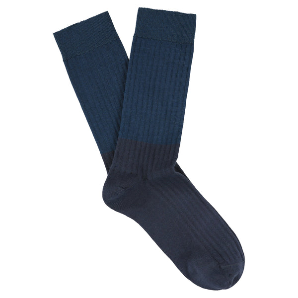 Pair of dark blue socks on a white background