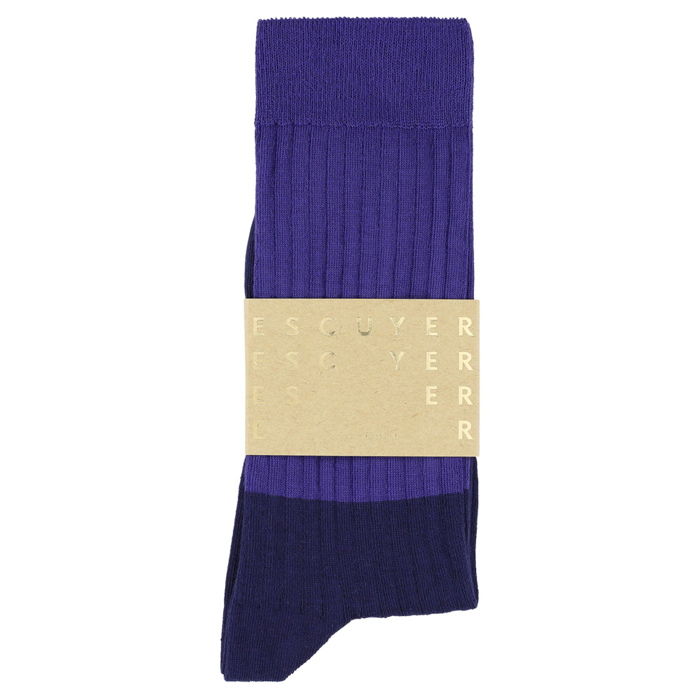 Purple sock with a gold label on a white background
