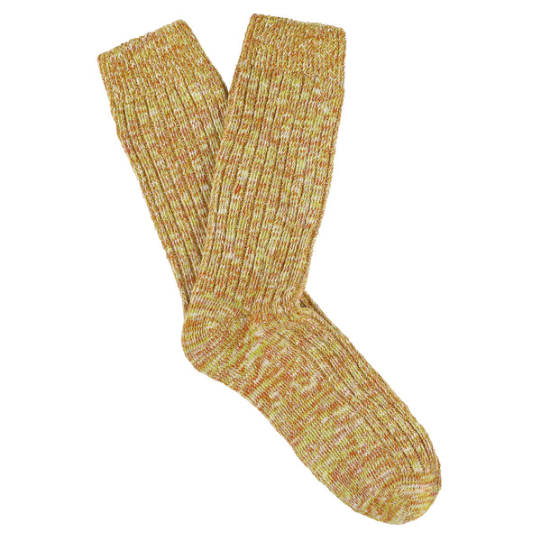 Pair of yellow knitted socks on a white background