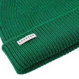 Side view of bold green ribbed merino wool beanie with folded cuff