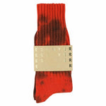One-of-a-kind men's tie dye crew socks in orange and black, hand-dyed, made in Portugal by Escuyer