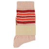 Knitted sock with red and white stripes on a beige background
