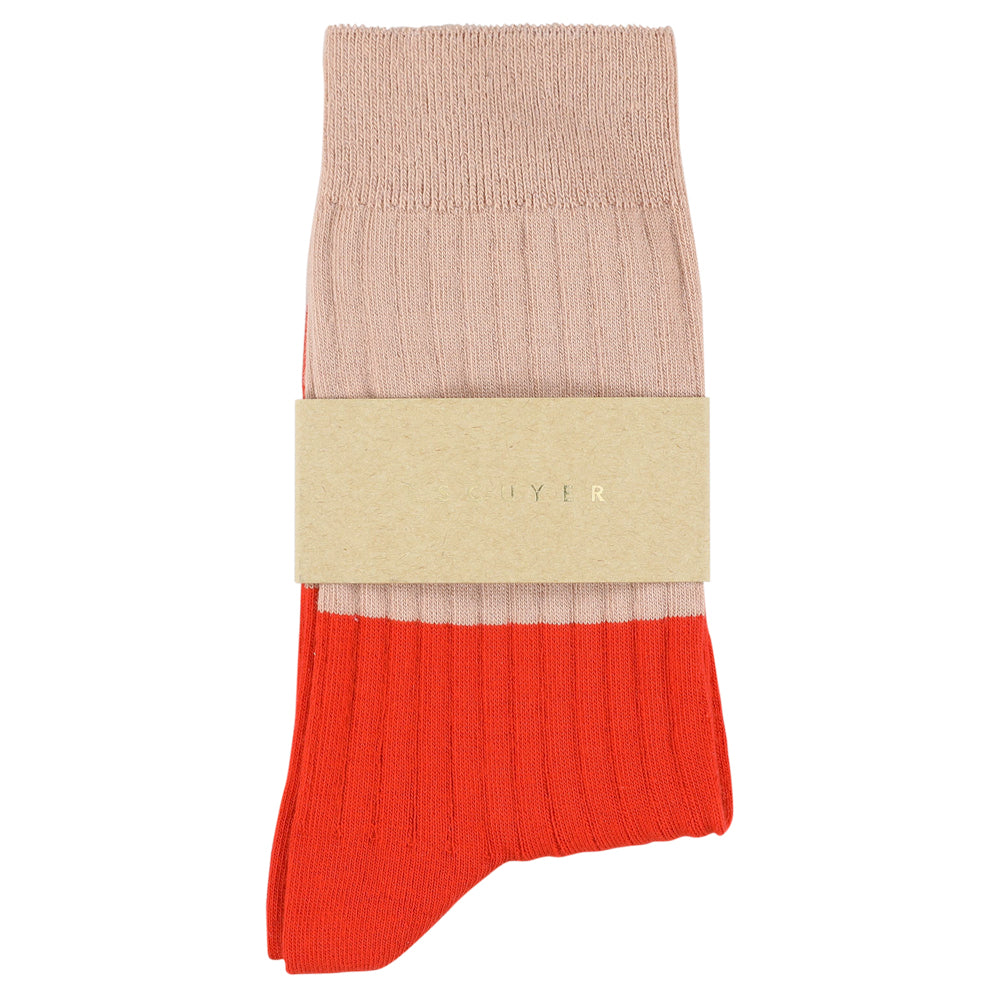 Color-blocked sock with beige and red sections on a white background