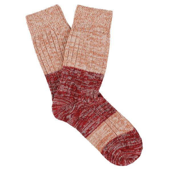 Pair of striped socks with red and brown pattern on a white background