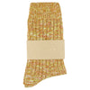 Marled yellow and orange sock with a beige band on a white background