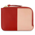 Escuyer pink and red zip wallet — vertical colour-block exterior, pink left, red right