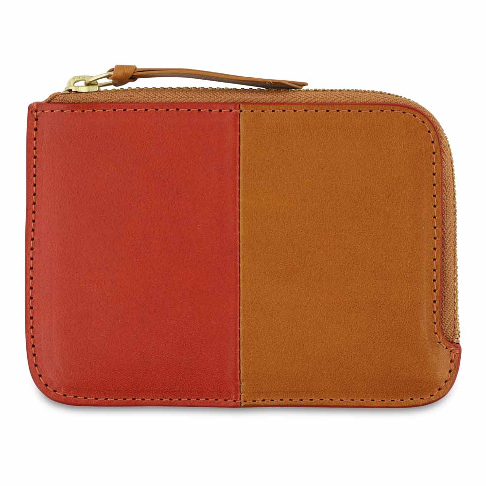 Escuyer orange and mustard zip wallet showing vertical colour-block split and zip closure