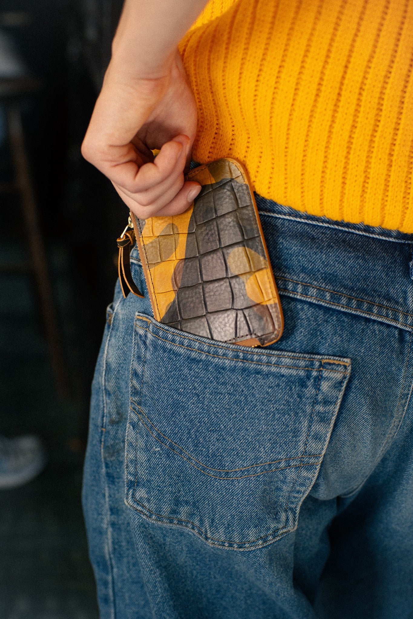 Escuyer camouflage zip wallet lifestyle — hand-dyed Italian full-grain veg-tan, made in Portugal