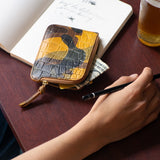 Escuyer crocodile camouflage zip wallet detail — croc emboss and hand-dyed camo ground