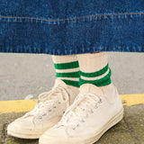 Woman wearing blue and purple striped crew socks by Escuyer, made in Portugal