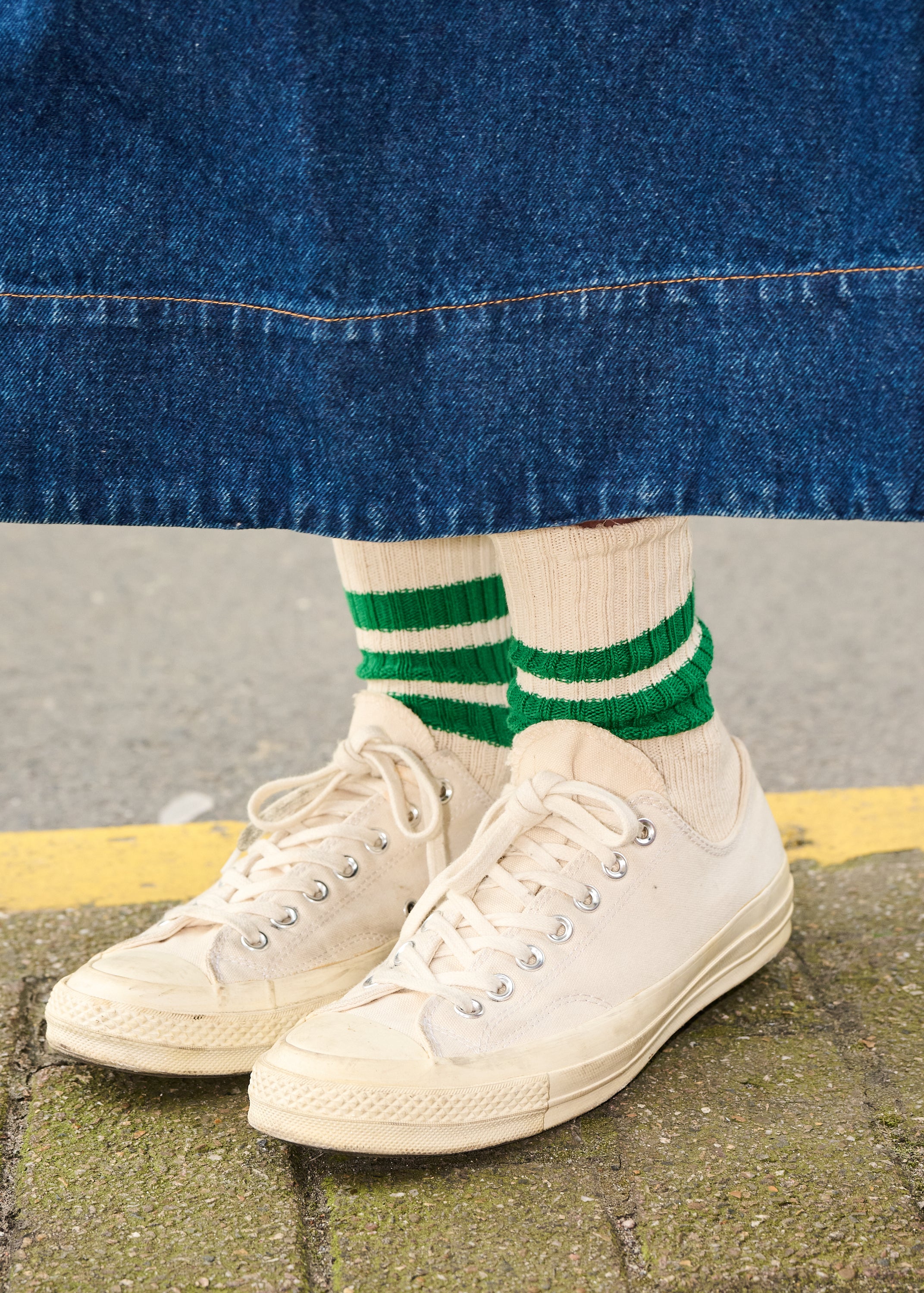 Woman wearing blue and purple striped crew socks by Escuyer, made in Portugal