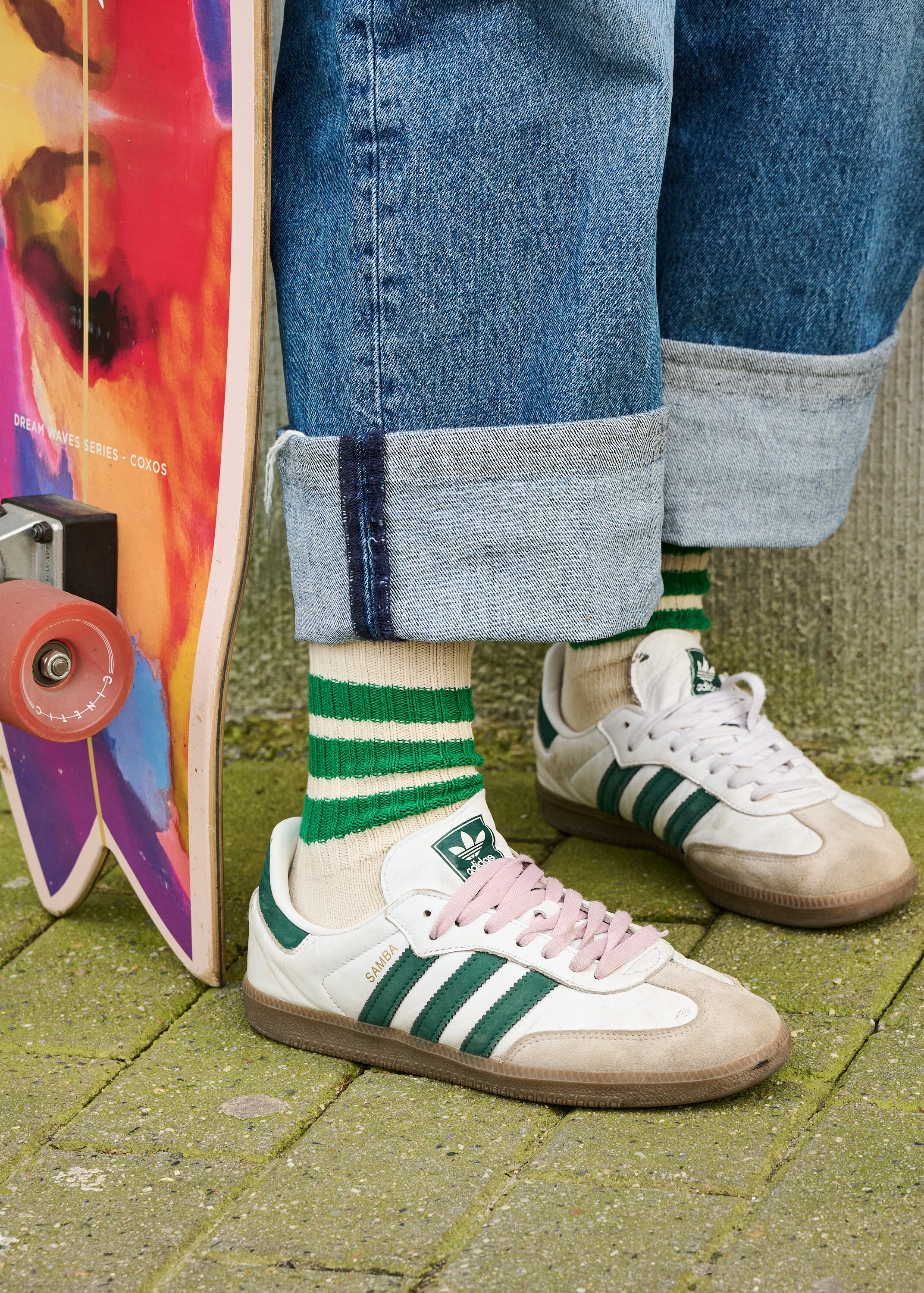 Woman wearing bright green and grey striped crew socks by Escuyer, made in Portugal