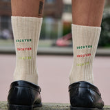 Woman wearing Escuyer logo ribbed crew socks, made in Portugal
