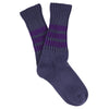 Pair of blue socks with purple stripes on a white background