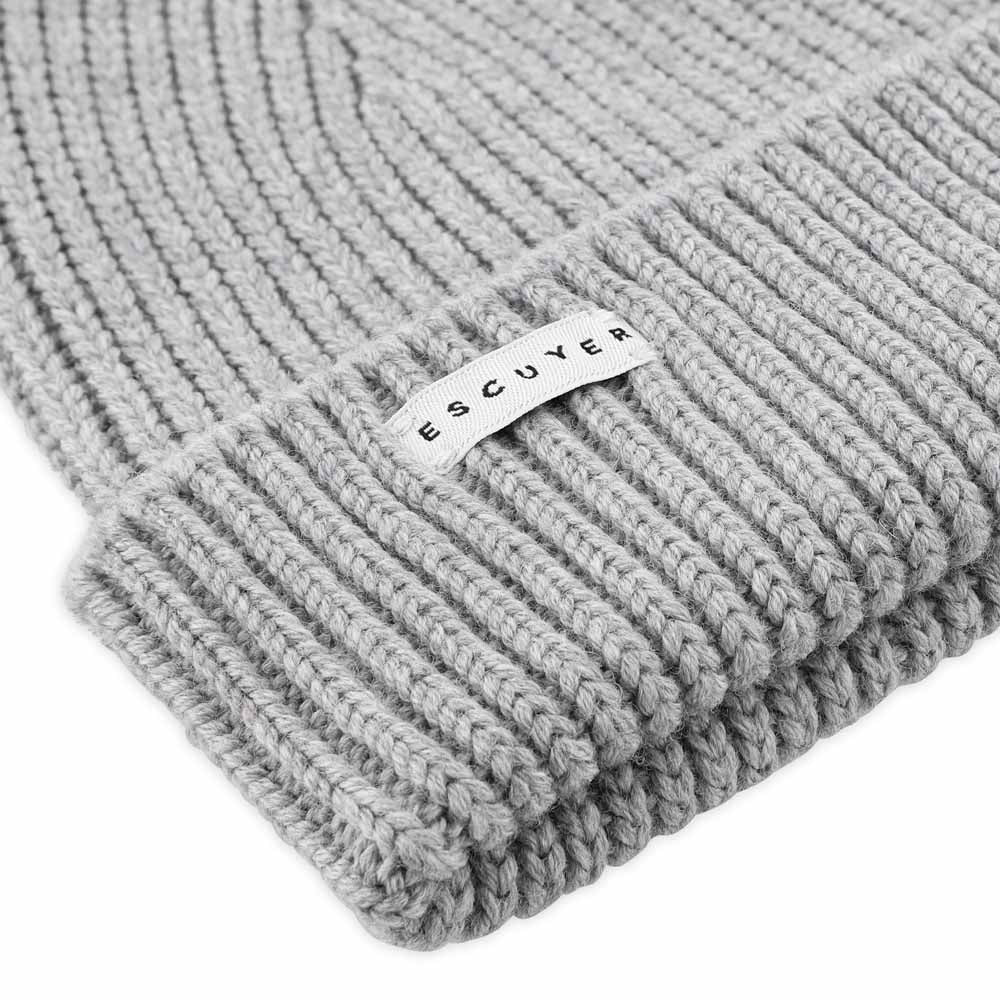 Side view of light grey ribbed merino wool beanie with folded cuff